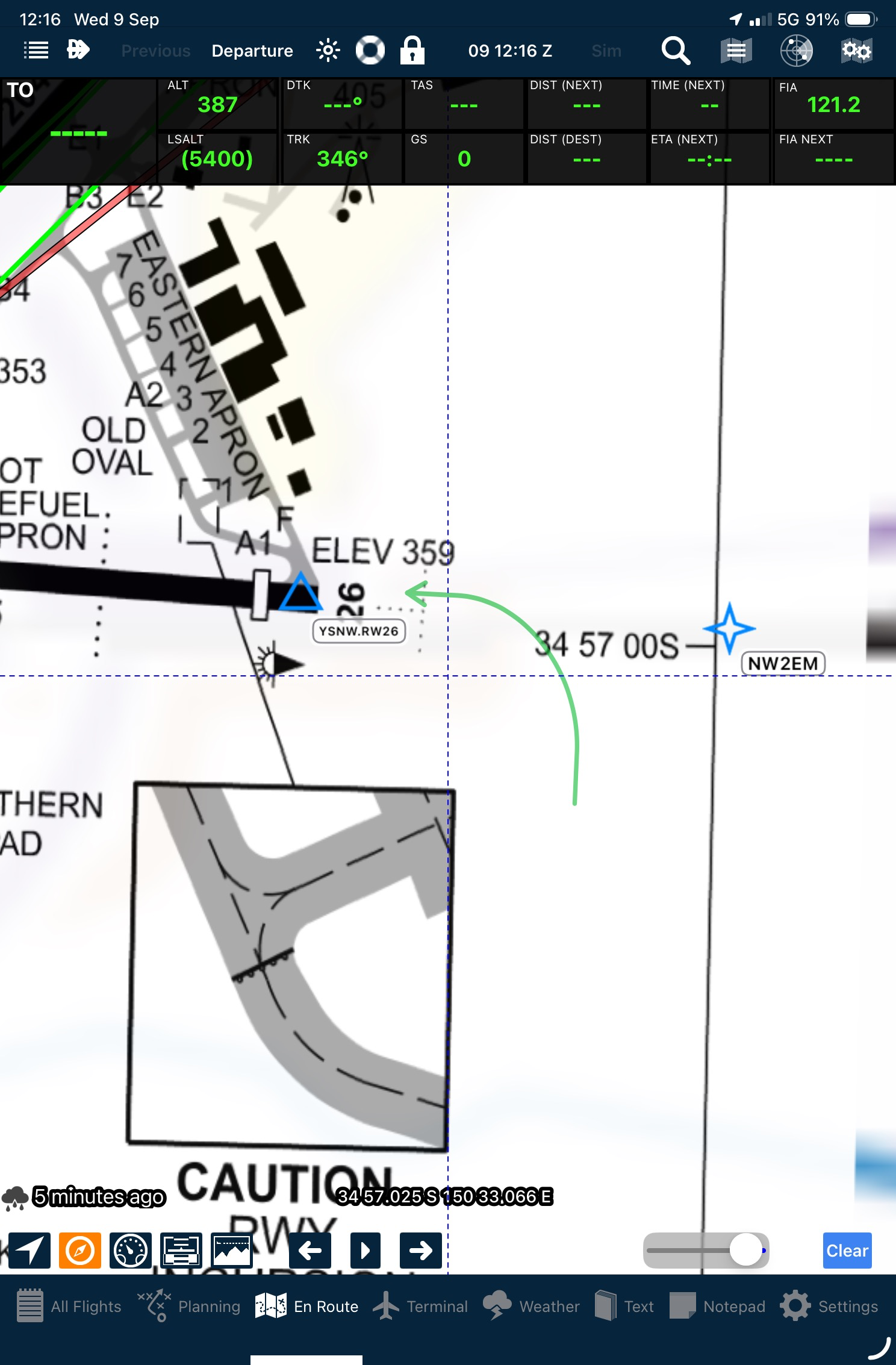 Green circuit direction arrow curving towards runway 26 on the Nowra airport diagram in the Apple En Route map