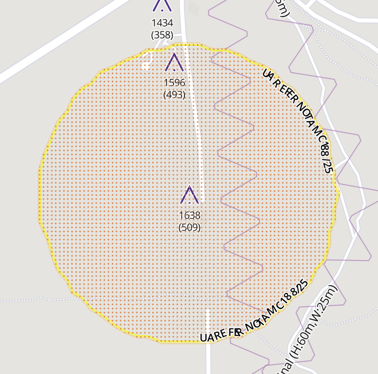 Active NOTAM-defined airspace shown with a bright-yellow outline and red dotted fill