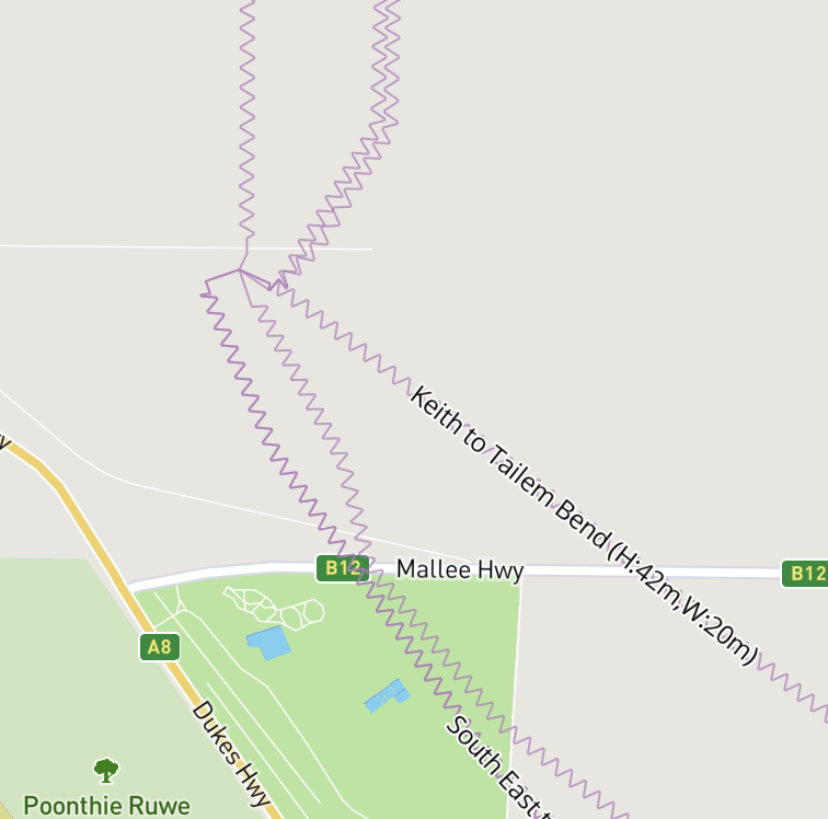 High-voltage powerline routes shown as purple zigzag lines